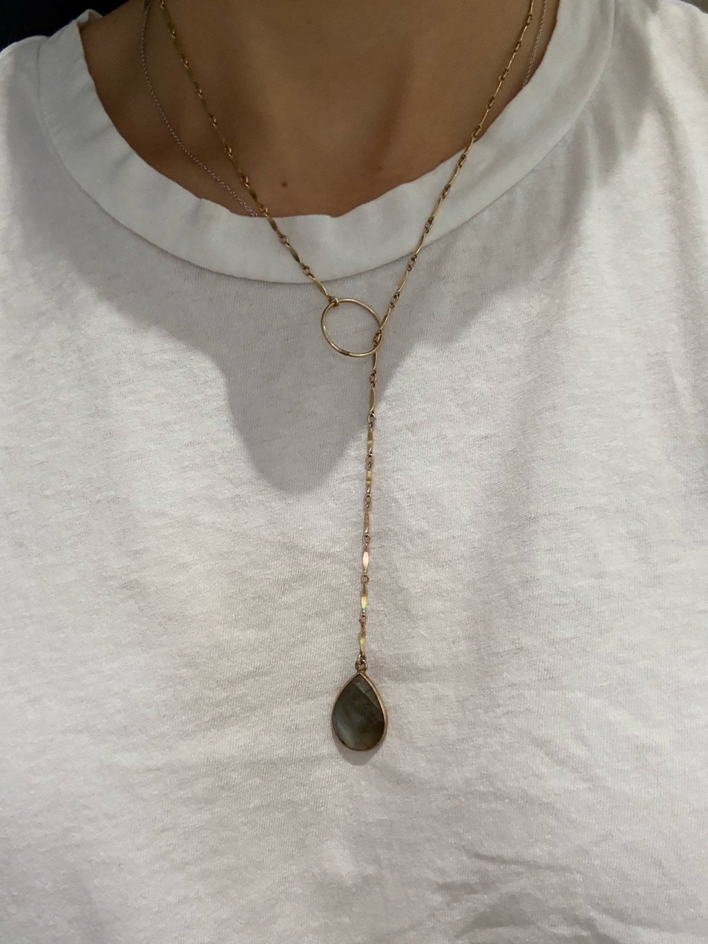 Gold tone and stone pendant